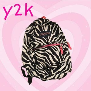 jansport zebra backpack with pink accent
